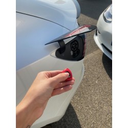 Remote control to open the charging hatch of your Tesla